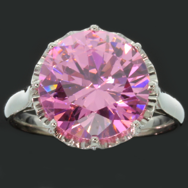 Estate platinum engagement ring with big pink stone